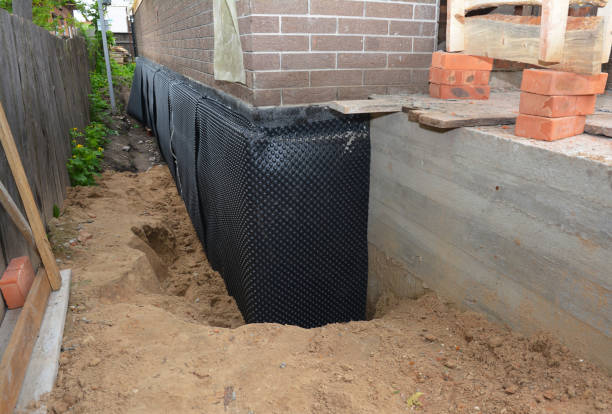 SJ Waterproofing Pros technician performing targeted Sump Pump Installation assessment in Manhasset, NY